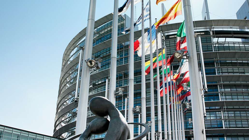 A building with flags from around the world in front