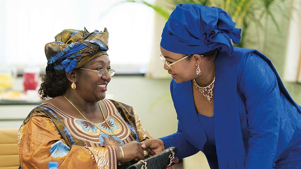 Two women shaking hands